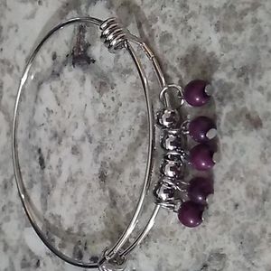 silver-tone bangle with purple beads
